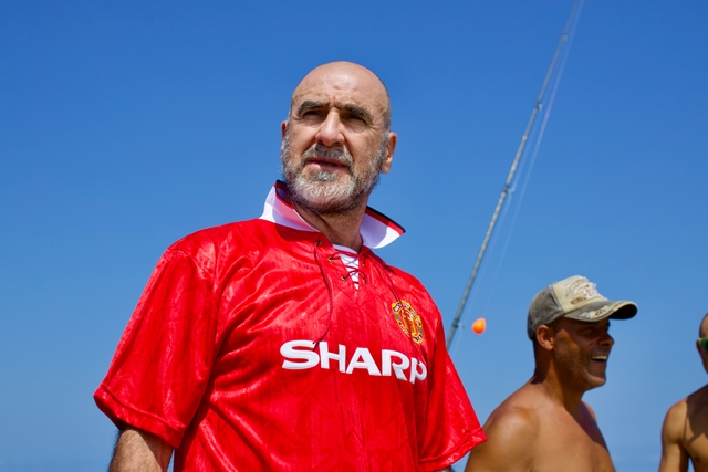 man wearing football shirt in blue sky day